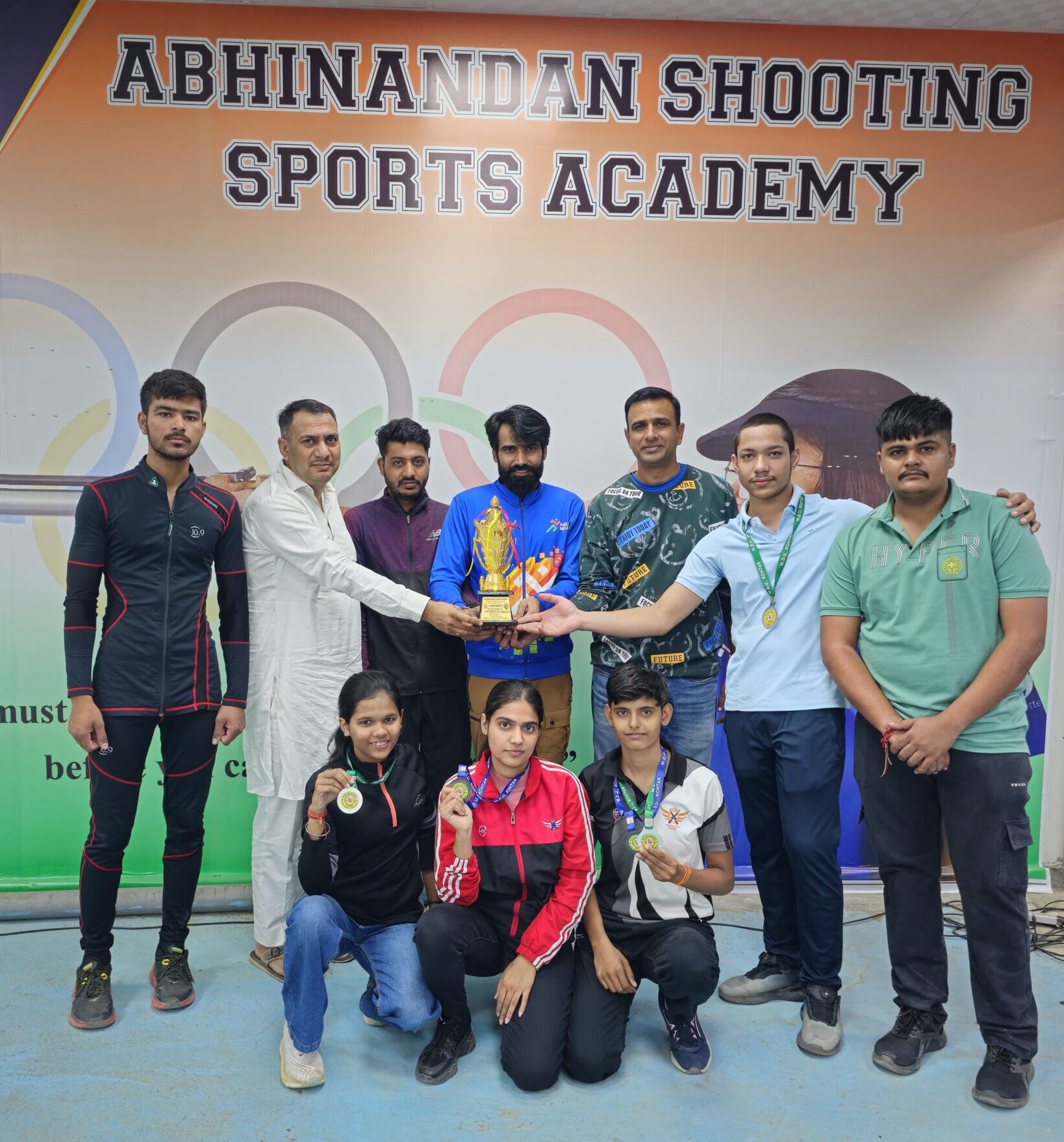 Trainees on the podium with medals